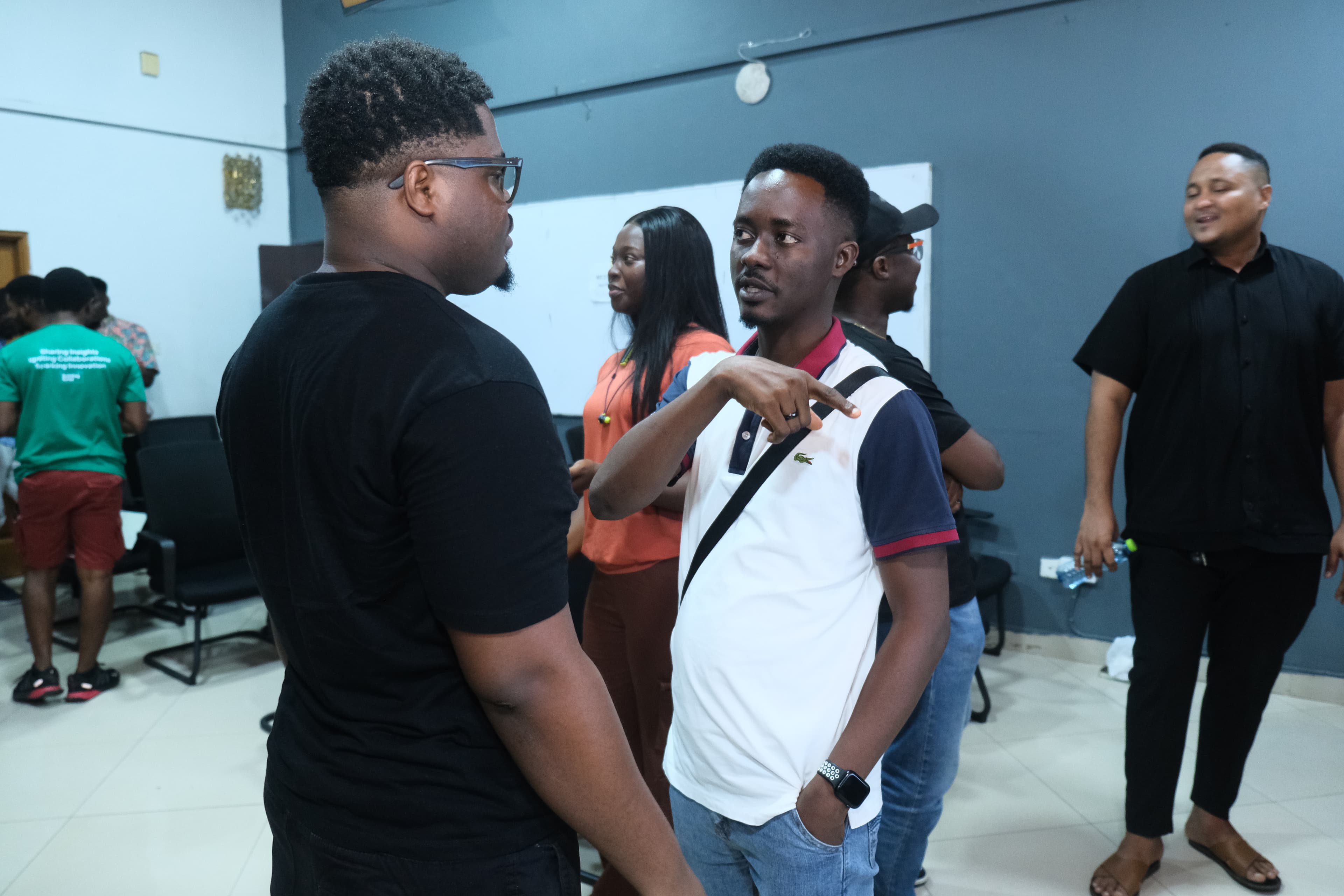 Attendees talking together after a session.